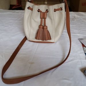 Tignenello crossbody bag.  7" top to bottom with 6" wide bottom, snap closure.
